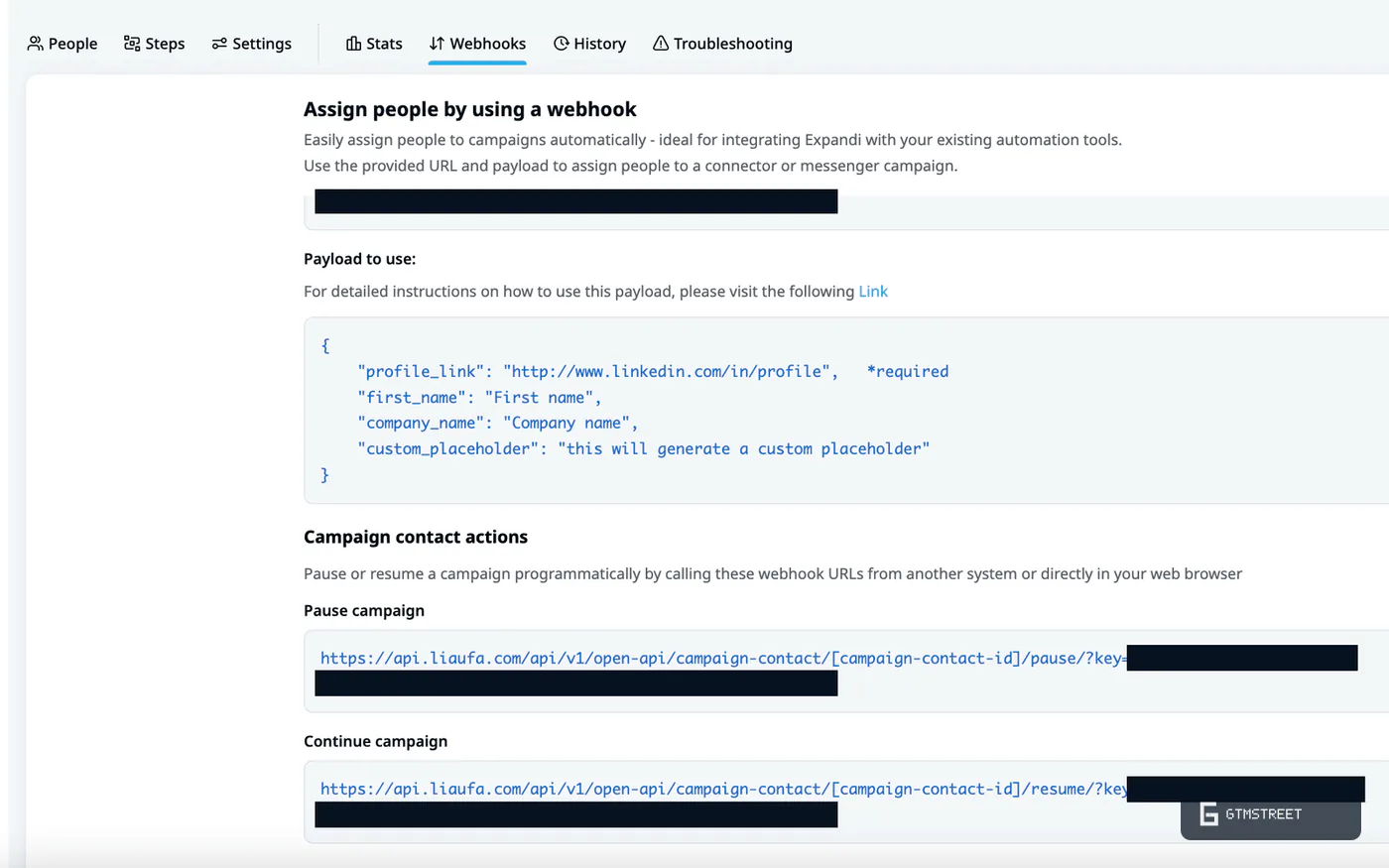 Expandi campaign Webhooks tab with the assign-by-webhook payload and the pause and resume URLs, key and secret redacted